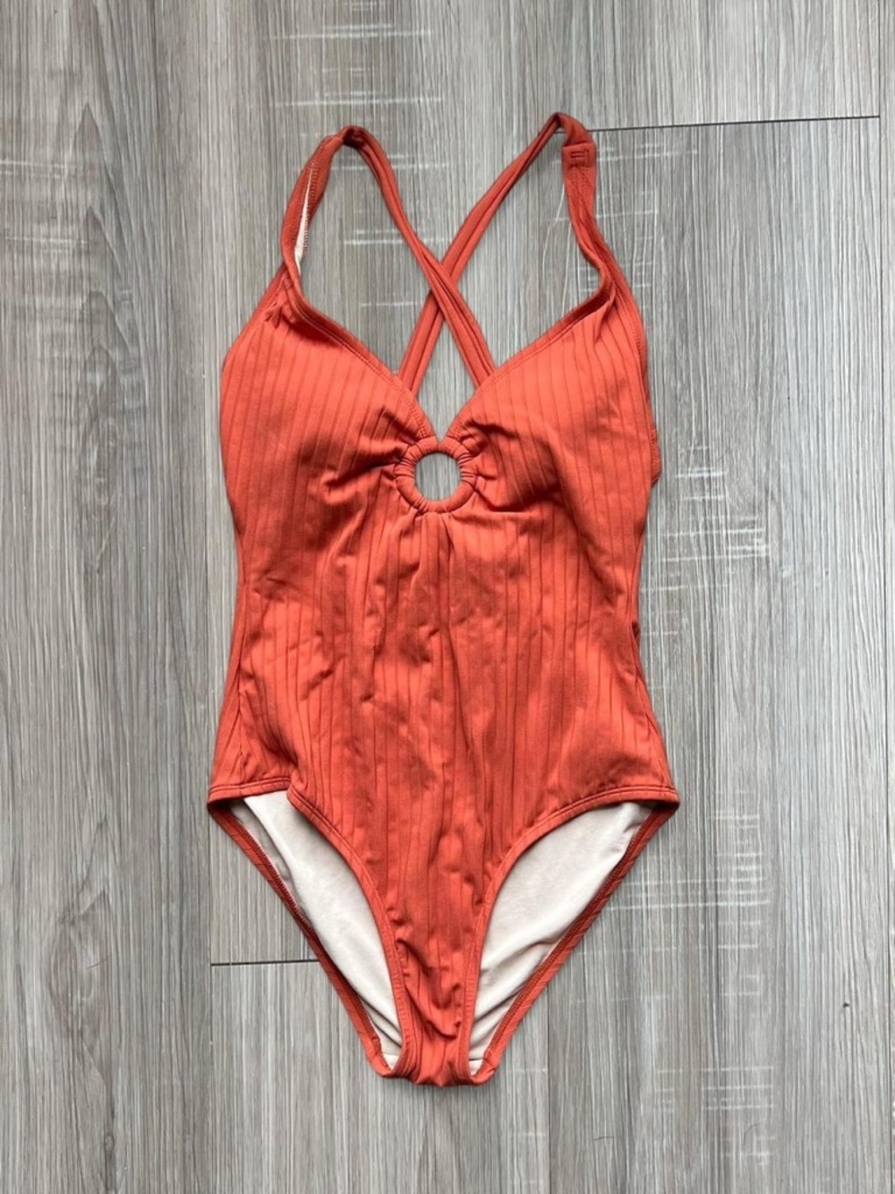 Ribbed orange one piece swimsuit with racer back and cut out detail